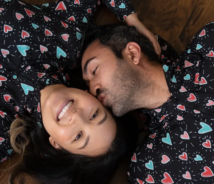 two people laying on the floor smiling